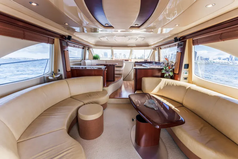  Yacht Photos Pics Luxurious interior of 2005 Sea Ray 550 Sedan Bridge yacht with elegant seating and panoramic windows.