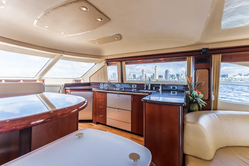  Yacht Photos Pics Luxurious interior of a 2005 Sea Ray 550 Sedan Bridge yacht with city skyline view.