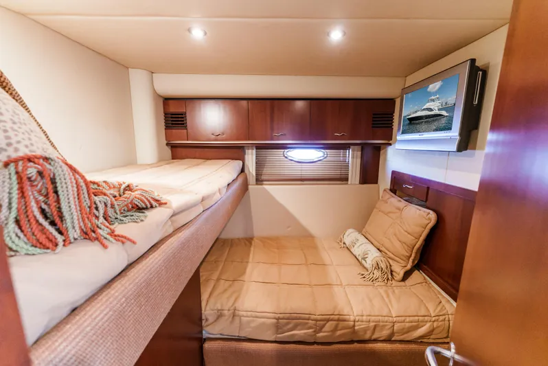  Yacht Photos Pics Luxurious cabin interior of 2005 Sea Ray 550 Sedan Bridge yacht with cozy bedding.