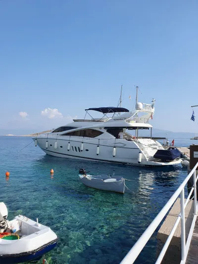 Tais Octavia Yacht Photos Pics Luxury Sunseeker 75 yacht docked in clear blue waters, 2005 model.