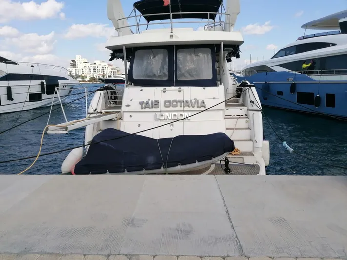 Tais Octavia Yacht Photos Pics Sunseeker 75 yacht docked at marina, rear view, 2005 model.