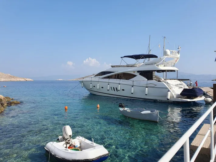 Tais Octavia Yacht Photos Pics Luxury Sunseeker 75 yacht docked in clear blue waters, 2005 model.