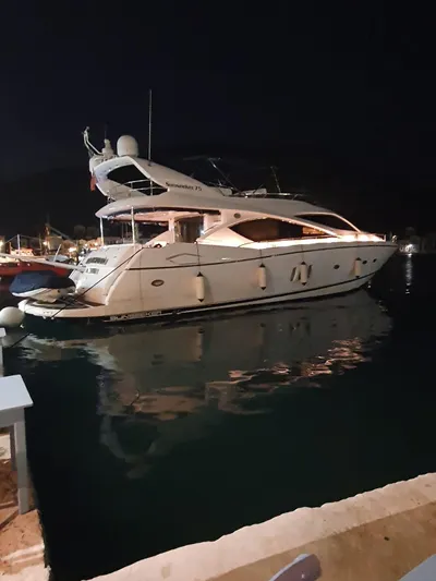 Tais Octavia Yacht Photos Pics Luxury 2005 Sunseeker 75 yacht docked at night.