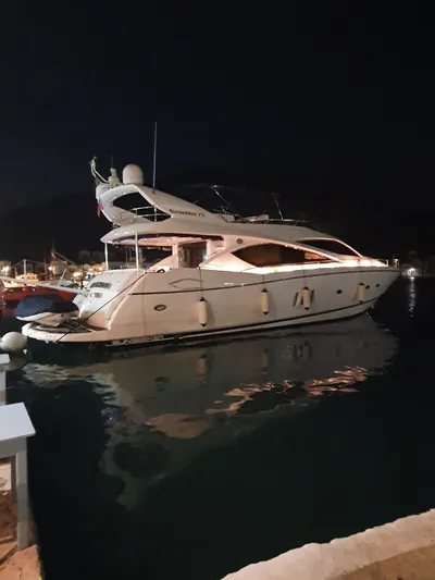 Tais Octavia Yacht Photos Pics Luxury Sunseeker 75 yacht from 2005 docked at night.