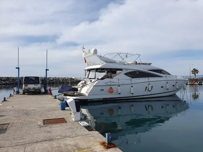 Tais Octavia Yacht Photos Pics Luxury Sunseeker 75 yacht docked at marina, 2005 model, calm waters, clear sky.