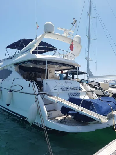 Tais Octavia Yacht Photos Pics 2005 Sunseeker 75 yacht docked, featuring spacious deck and elegant design.