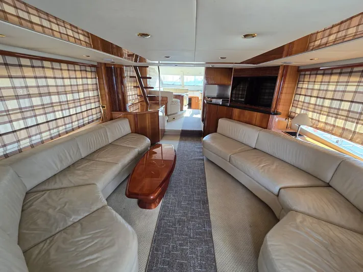 Tais Octavia Yacht Photos Pics Luxurious interior of a 2005 Sunseeker 75 yacht with elegant seating and wood accents.