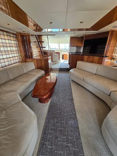 Tais Octavia Yacht Photos Pics Luxurious interior of a 2005 Sunseeker 75 yacht with elegant seating and wooden finishes.