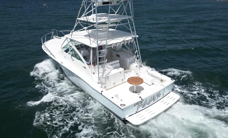 Feeva Yacht Photos Pics 2007 Cabo 40 Hardtop Express yacht cruising on open water.