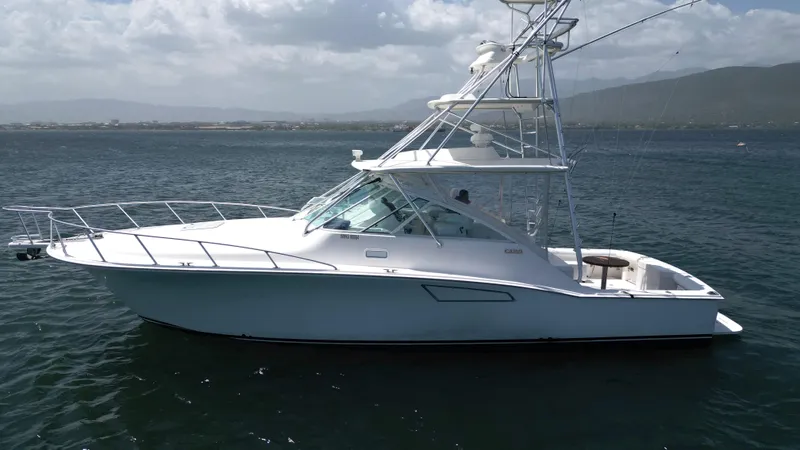 Feeva Yacht Photos Pics 2007 Cabo 40 Hardtop Express yacht on calm waters, side view.
