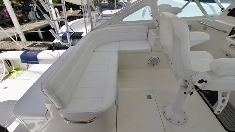 Feeva Yacht Photos Pics 2007 Cabo 40 Hardtop Express boat interior with white seating and helm station.