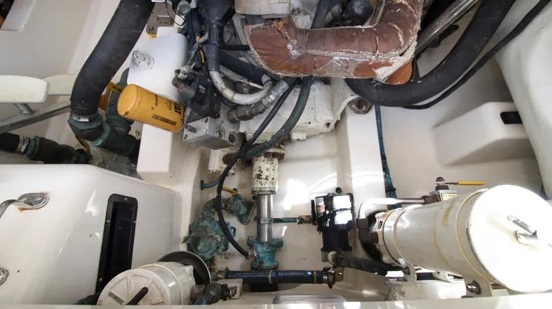 Feeva Yacht Photos Pics Engine compartment of a 2007 Cabo 40 Hardtop Express boat, showcasing mechanical components.