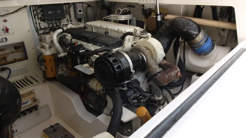 Feeva Yacht Photos Pics Engine room of a 2007 Cabo 40 Hardtop Express boat, showcasing mechanical components.