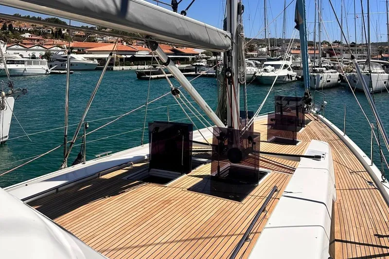  Yacht Photos Pics 2018 Hanse 548 yacht docked in marina, showcasing sleek deck design and vibrant blue waters.
