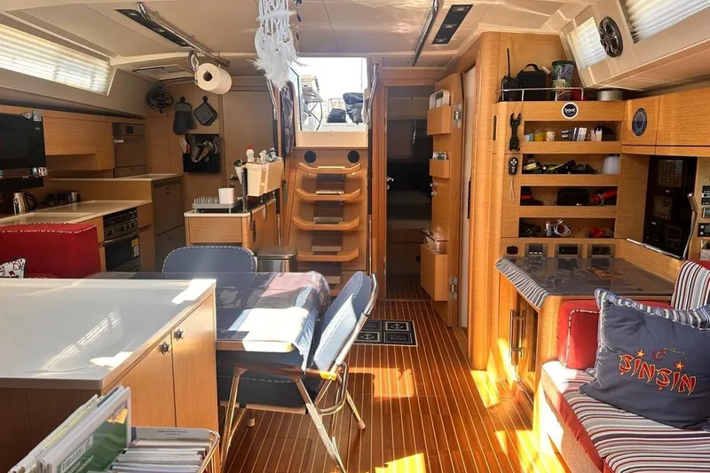  Yacht Photos Pics Luxurious interior of 2018 Hanse 548 yacht with modern kitchen and cozy seating area.