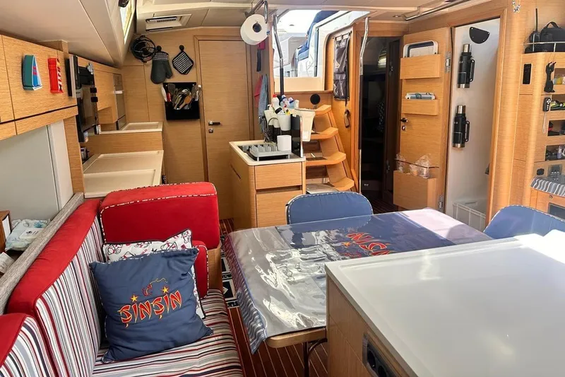  Yacht Photos Pics Interior of 2018 Hanse 548 yacht with modern kitchen and cozy seating area.