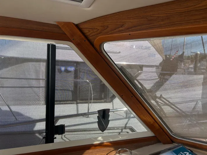 Freedom Yacht Photos Pics Interior view of a 2008 Legacy 32 boat with wooden window frames.
