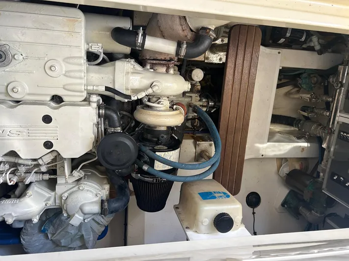 Freedom Yacht Photos Pics Engine compartment of a 2008 Legacy 32 boat, showcasing mechanical components and hoses.