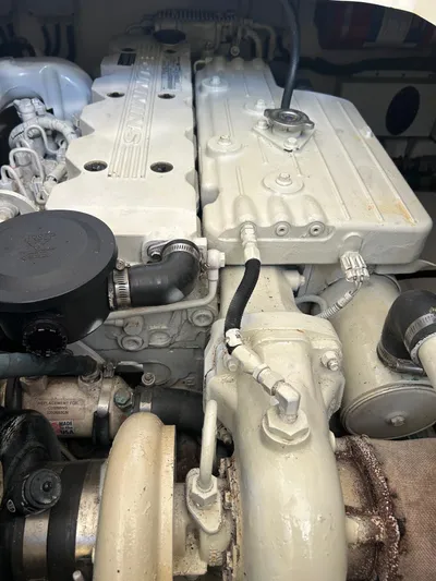 Freedom Yacht Photos Pics Close-up of a 2008 Legacy 32 engine, showcasing detailed components and connections.