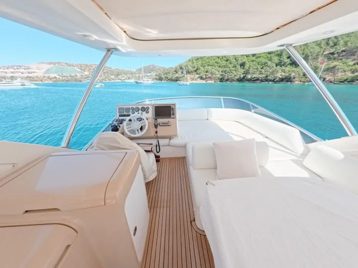  Yacht Photos Pics Luxurious 2010 Azimut 64 yacht interior with scenic ocean view and modern helm.