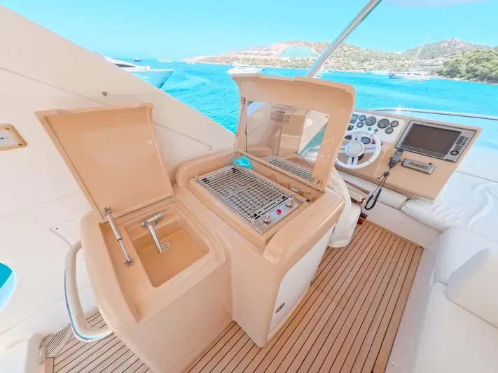  Yacht Photos Pics Luxury Azimut 64 yacht interior with sink, grill, and navigation controls, 2010 model.