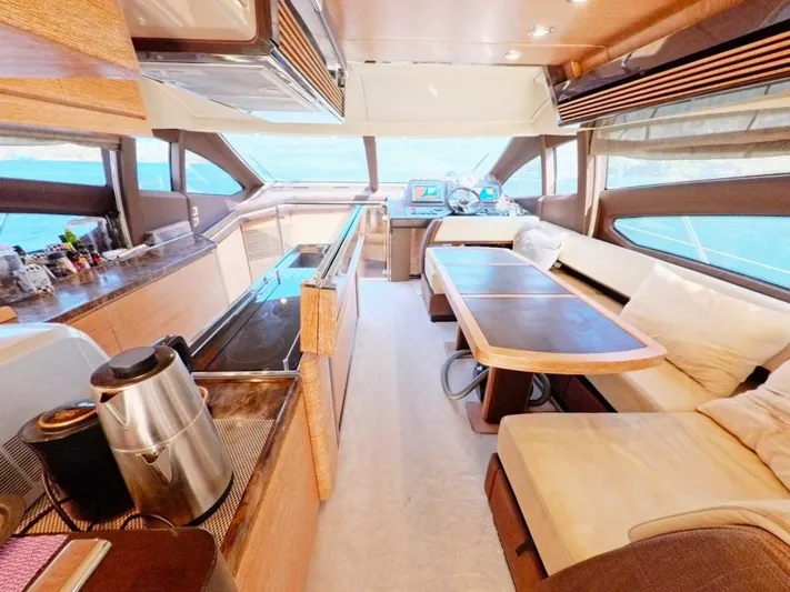  Yacht Photos Pics Luxurious interior of a 2010 Azimut 64 yacht with modern kitchen and seating area.