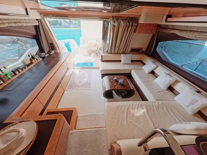  Yacht Photos Pics Luxurious interior of a 2010 Azimut 64 yacht with elegant seating and panoramic windows.