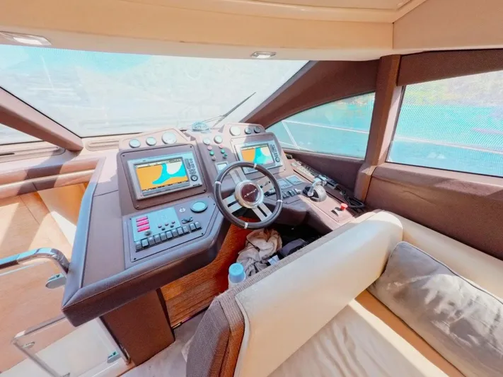  Yacht Photos Pics Interior view of 2010 Azimut 64 yacht cockpit with navigation controls and steering wheel.