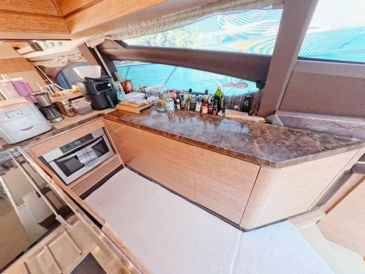  Yacht Photos Pics Luxurious kitchen interior of a 2010 Azimut 64 yacht with modern appliances.
