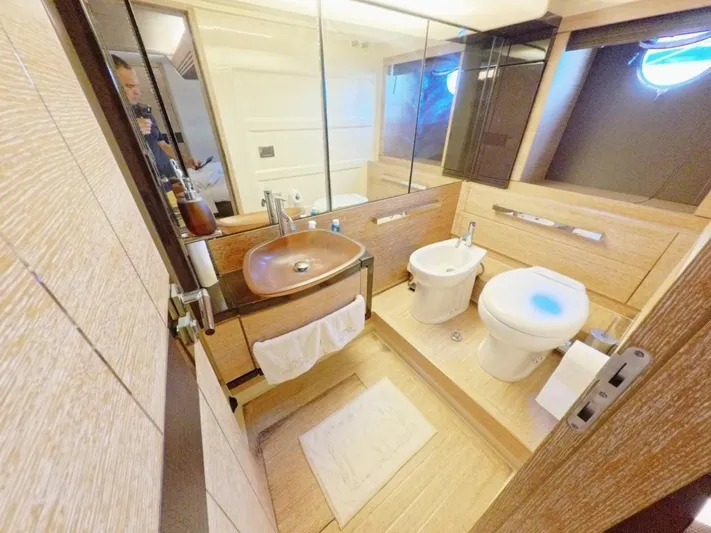  Yacht Photos Pics Luxurious bathroom interior of a 2010 Azimut 64 yacht, featuring modern fixtures and elegant design.