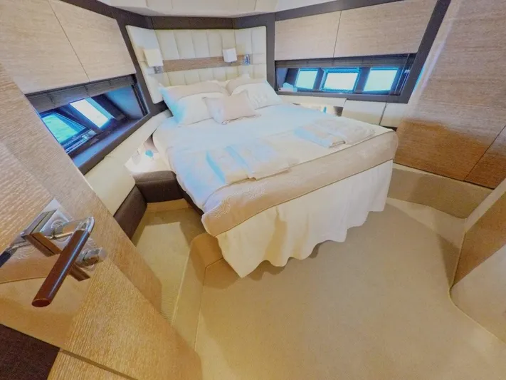  Yacht Photos Pics Luxurious bedroom interior of 2010 Azimut 64 yacht with elegant bedding and modern design.