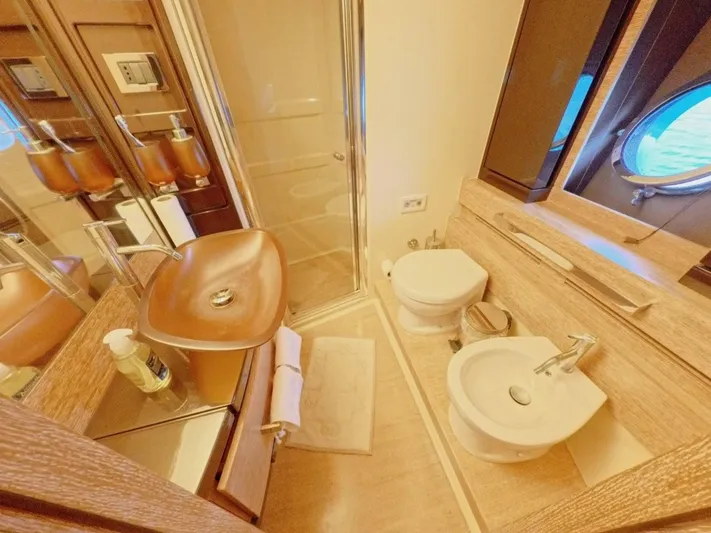  Yacht Photos Pics Luxurious bathroom in 2010 Azimut 64 yacht with modern fixtures and elegant design.