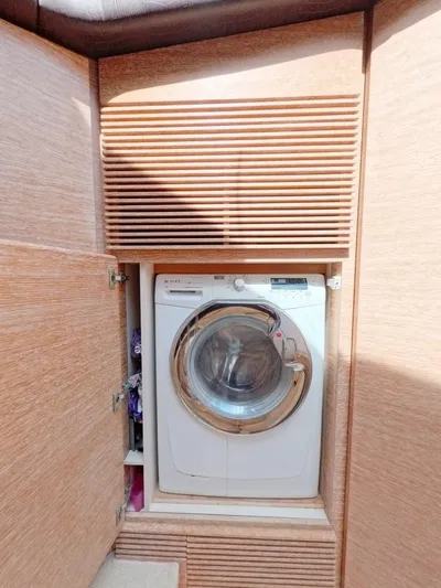  Yacht Photos Pics Washing machine in wooden cabinet on 2010 Azimut 64 yacht.