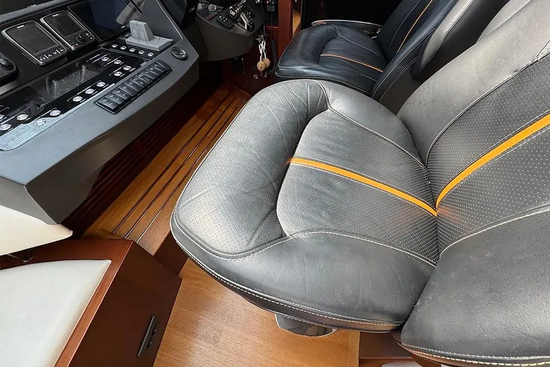  Yacht Photos Pics Luxury interior of 2016 Princess S72 yacht with leather seating and control panel.