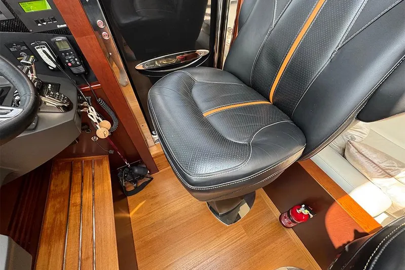  Yacht Photos Pics Captain's seat and controls in 2016 Princess S72 yacht cockpit.