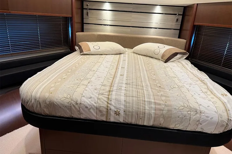  Yacht Photos Pics Luxurious bedroom interior of 2016 Princess S72 yacht with elegant bedding and modern design.
