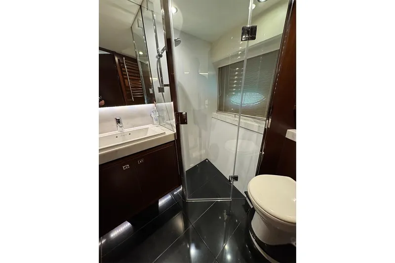  Yacht Photos Pics Luxurious bathroom in 2016 Princess S72 yacht with glass shower and modern fixtures.