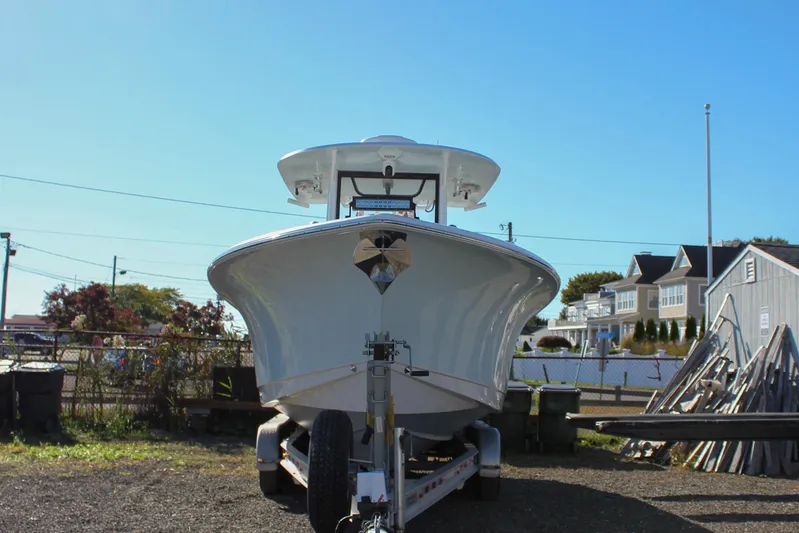  Yacht Photos Pics 2018 Sea Hunt Gamefish 30 boat on trailer, parked outdoors under clear blue sky.