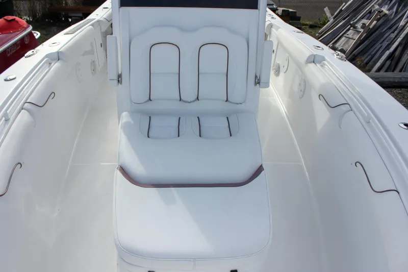  Yacht Photos Pics 2018 Sea Hunt Gamefish 30 boat interior with white cushioned seating.