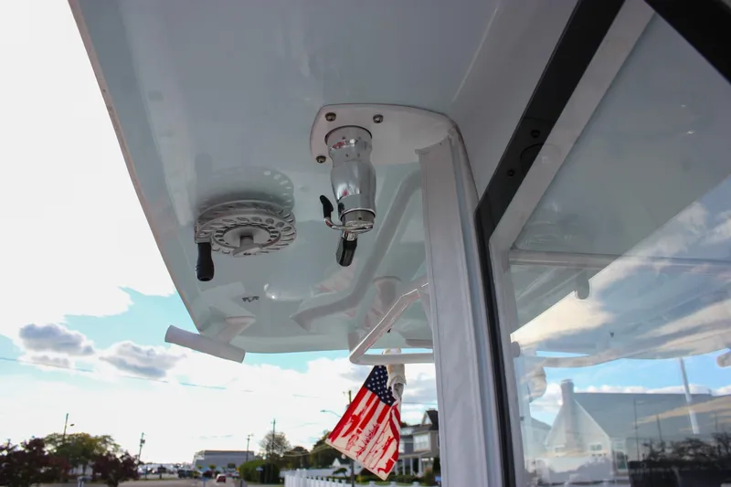  Yacht Photos Pics 2018 Sea Hunt Gamefish 30 boat detail with American flag and clear sky.