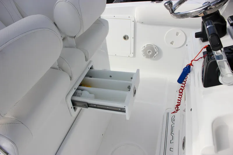  Yacht Photos Pics 2018 Sea Hunt Gamefish 30 boat interior with storage drawer and steering wheel.