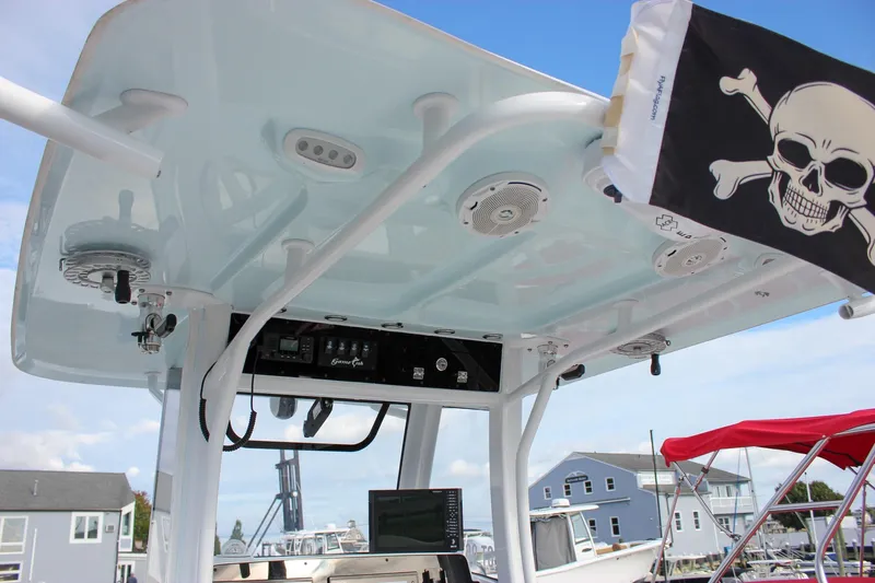  Yacht Photos Pics 2018 Sea Hunt Gamefish 30 boat with T-top, speakers, and pirate flag in marina setting.