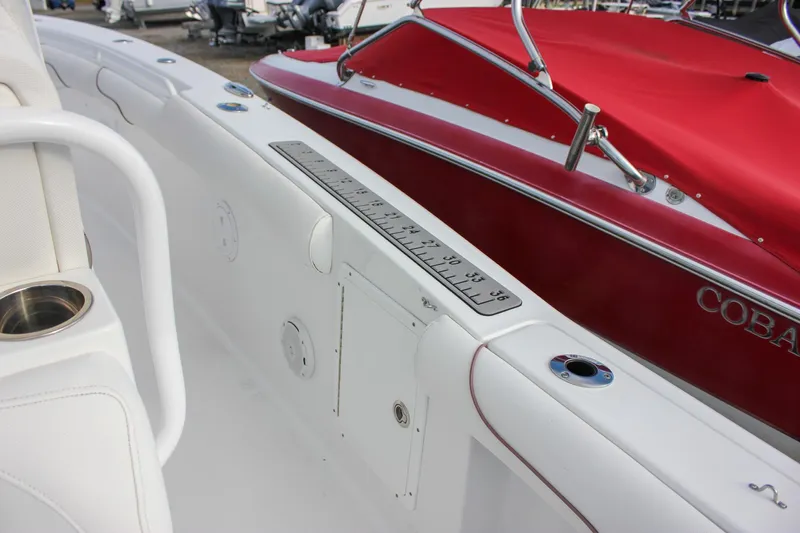  Yacht Photos Pics 2018 Sea Hunt Gamefish 30 interior with measuring ruler and cup holder.