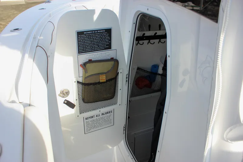  Yacht Photos Pics 2018 Sea Hunt Gamefish 30 boat interior storage compartment with safety instructions.