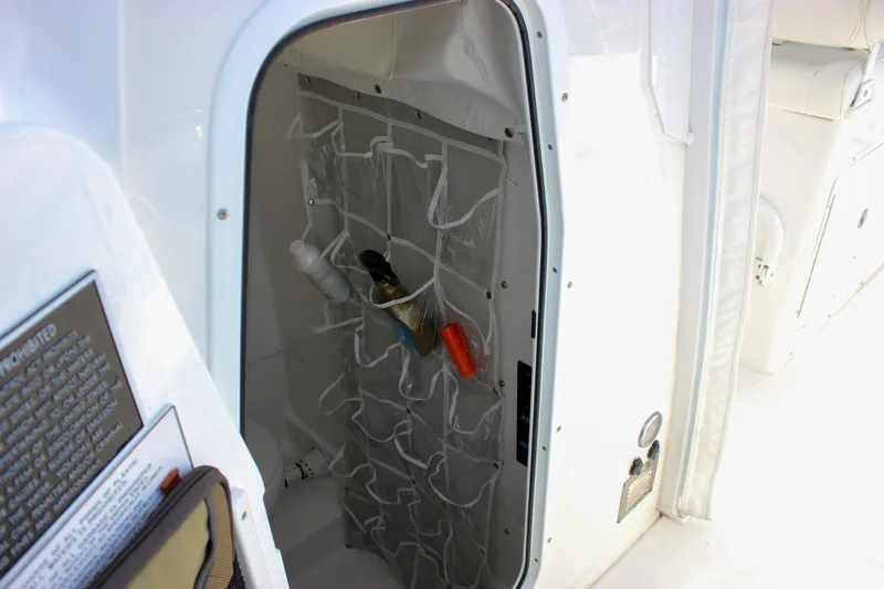  Yacht Photos Pics 2018 Sea Hunt Gamefish 30 storage compartment with organized pockets and cleaning supplies.