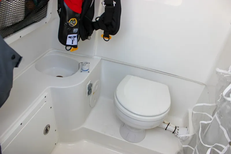  Yacht Photos Pics 2018 Sea Hunt Gamefish 30 boat interior with toilet and sink.