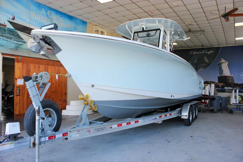  Yacht Photos Pics 2018 Sea Hunt Gamefish 30 boat on trailer in indoor showroom.