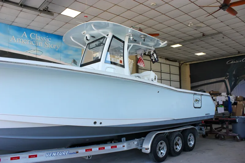  Yacht Photos Pics 2018 Sea Hunt Gamefish 30 boat on trailer in indoor showroom.