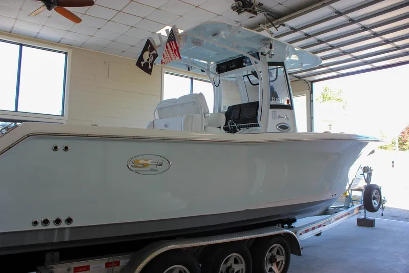  Yacht Photos Pics 2018 Sea Hunt Gamefish 30 boat on trailer in garage setting.