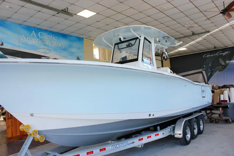  Yacht Photos Pics 2018 Sea Hunt Gamefish 30 boat on trailer in showroom.